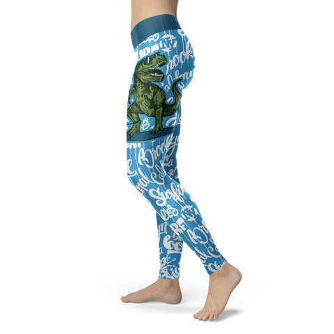 Image of Surfing Leggings T-Rex Surfing With Surf Text