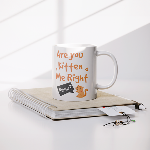 Image of Are_You_Kitten_Me_Right_Meow_11oz_Mug_Lifestyle_Notebook_Mockup.png