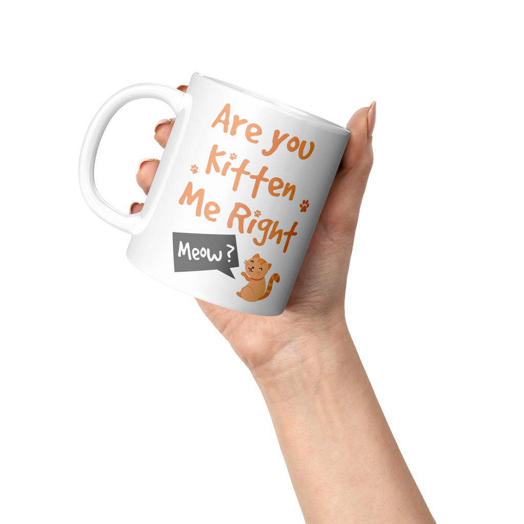 Are_You_Kitten_Me_Right_Meow_11oz_Mug_Lifestyle_Raised_Hand_LH_Mockup.png