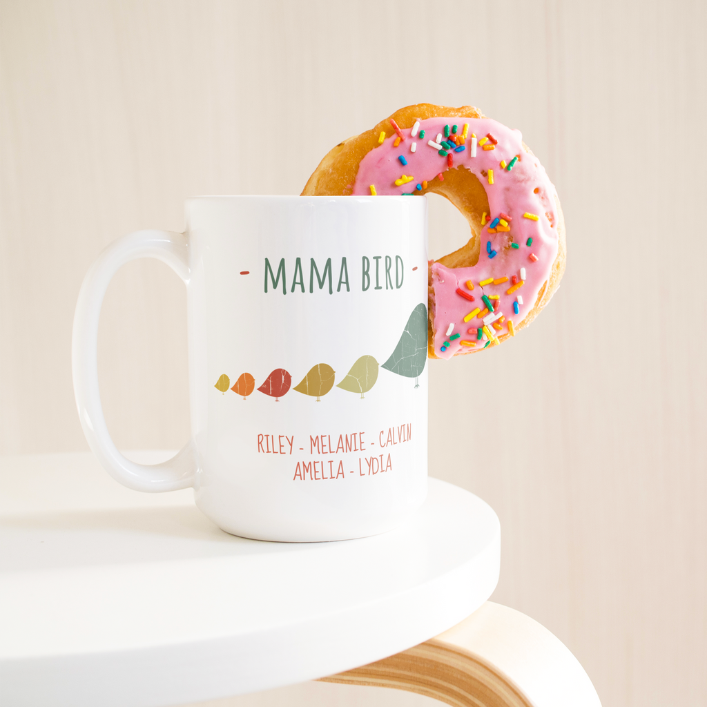 Mama_Bird_with_5_Chicks_15oz_Mug_15ozWhiteMugLifetsyleDonutLH_Mockup.png_15900394