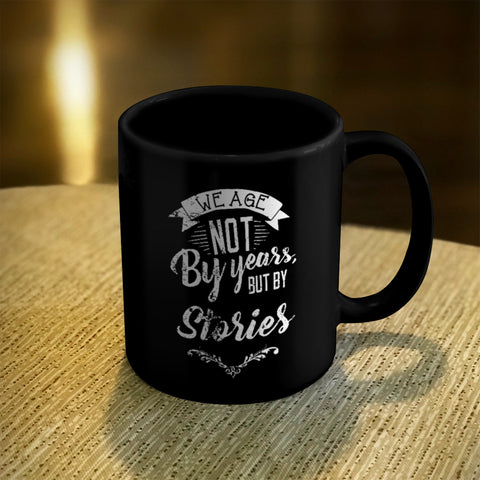 Image of Ceramic Coffee Mug Black We Age Not By Years, But By Stories